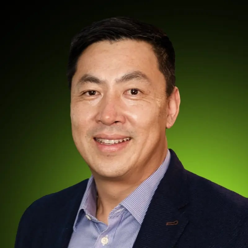 a photo of Tim Tran on a green and black gradient background