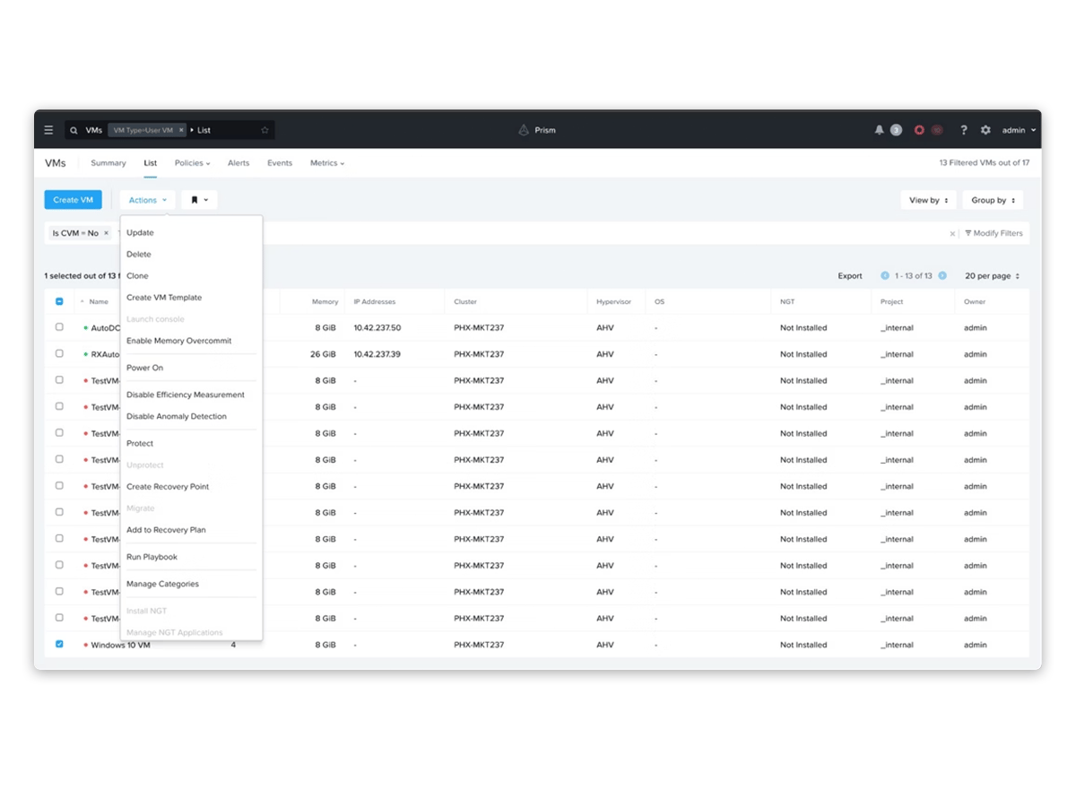 Web-based management dashboard showing a table of virtual machines with status, memory, cluster, and operating system columns, and an actions menu open.