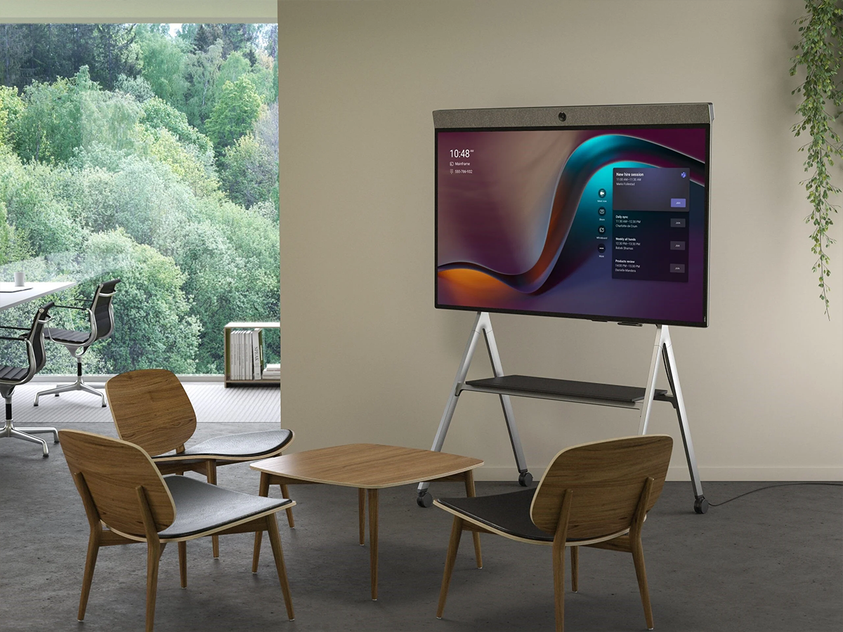 Office space with a Neat meeting board display on a movable stand