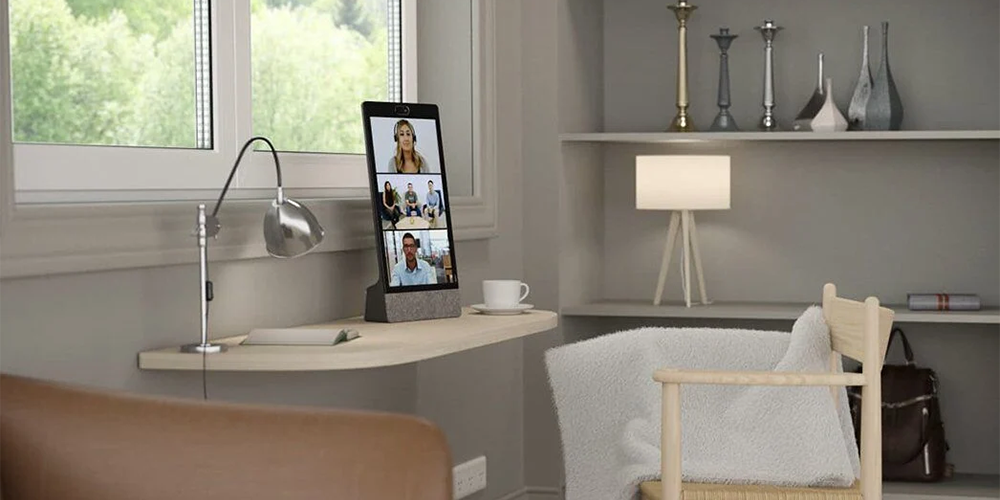 Modern home office with a portrait neat frame displaying a video conference call
