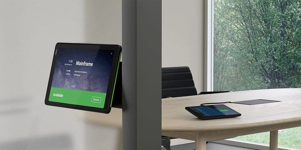 Entry to meeting room with a room digital panel showing the room is available